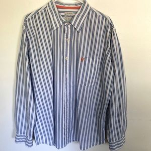Striped mens shirt, blue, white and turquoise strip with a splash of orange.
